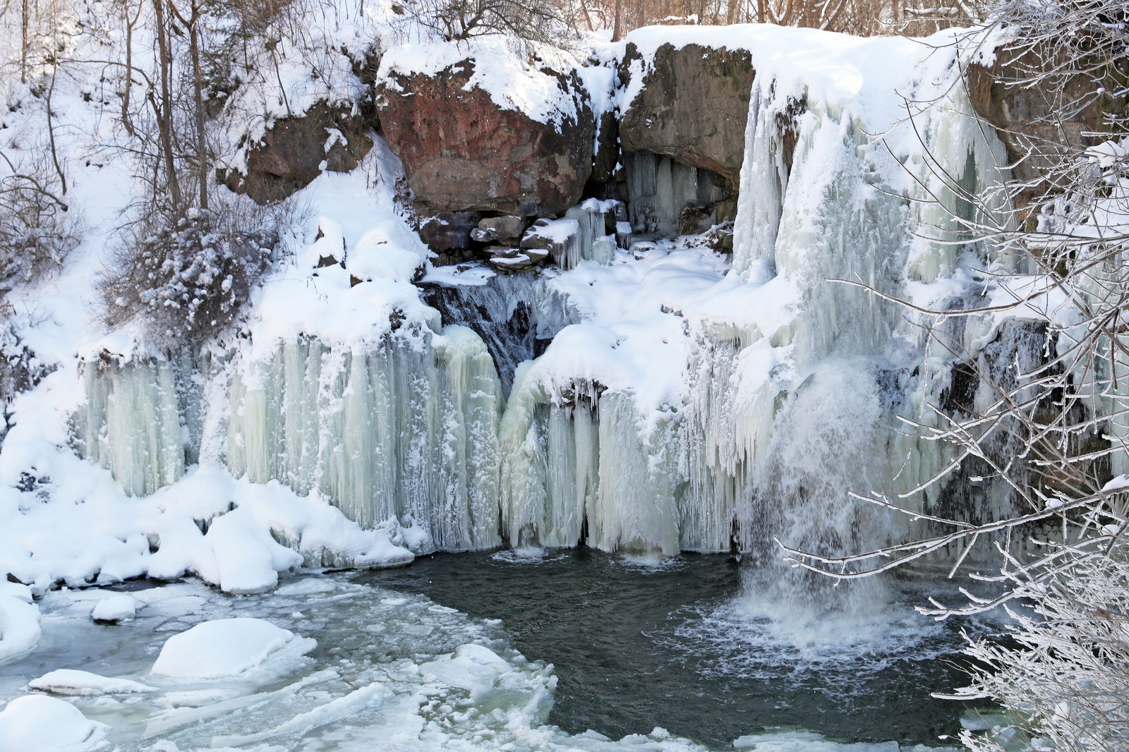 Ice forms on the the 40-foot waterfall on Murder Creek in Akron Falls Park